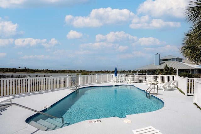 pool featuring a patio and fence