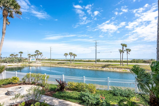 view of water feature with fence private yard