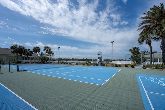 view of tennis court with fence