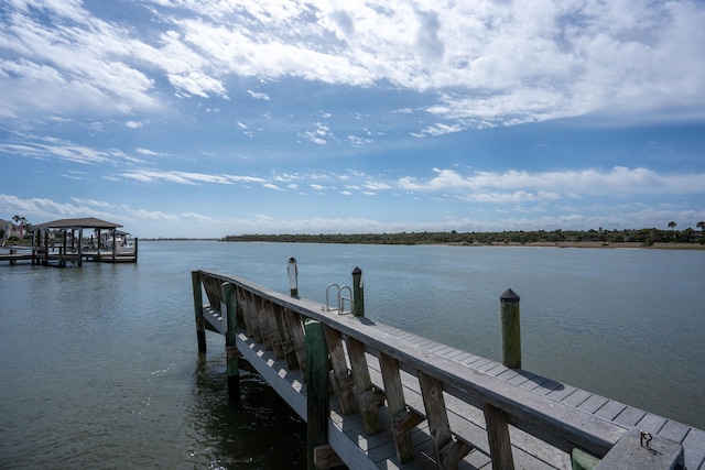 dock area featuring a water view