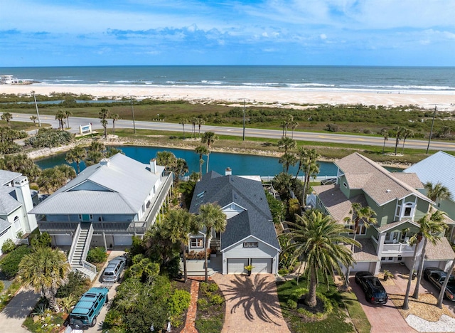 aerial view with a view of the beach and a water view