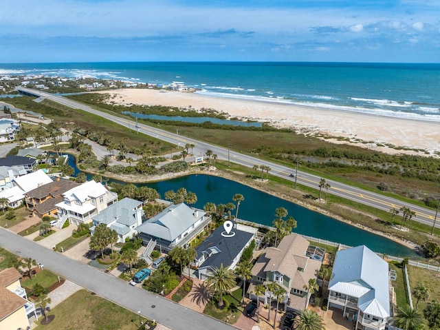 birds eye view of property featuring a water view and a residential view