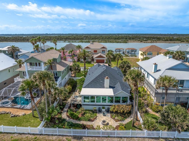 bird's eye view with a residential view and a water view