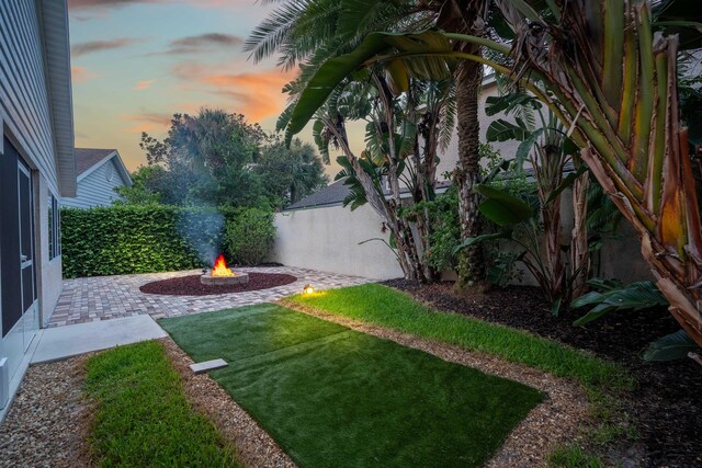 362 Monika Pl, Saint Augustine, FL 32080 - yard at dusk featuring an outdoor fire pit