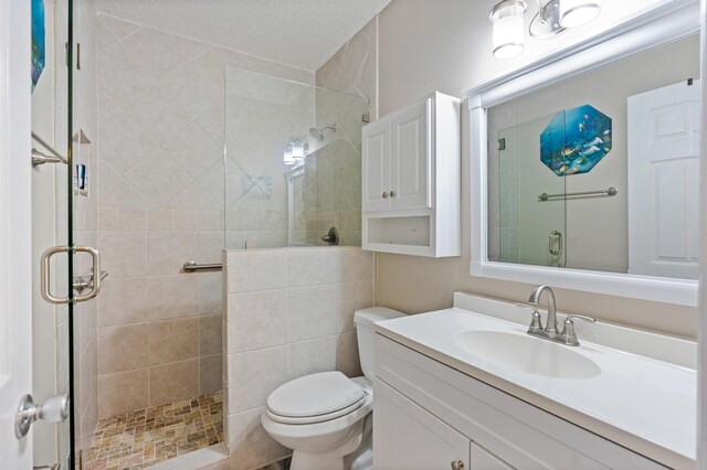 362 Monika Pl, Saint Augustine, FL 32080 - bathroom featuring walk in shower, vanity, a textured ceiling, and toilet