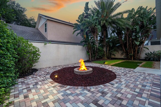 362 Monika Pl, Saint Augustine, FL 32080 - patio terrace at dusk with an outdoor fire pit