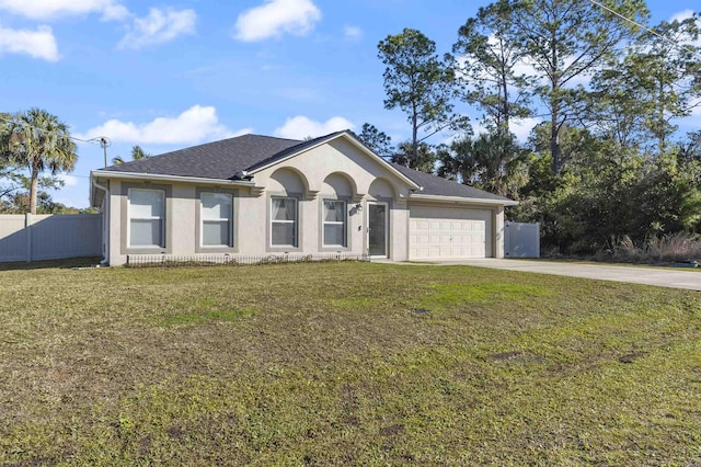 single story home featuring a garage and a front lawn