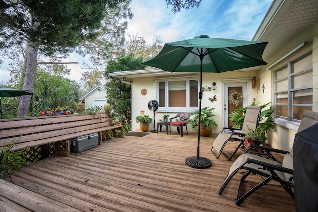 wooden terrace with an outdoor structure