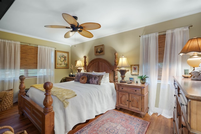 bedroom with ceiling fan, ornamental molding, and light hardwood / wood-style flooring