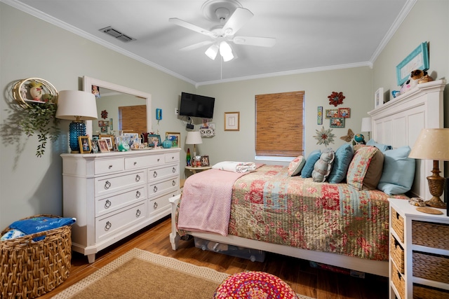 bedroom with wood-type flooring, ceiling fan, and crown molding