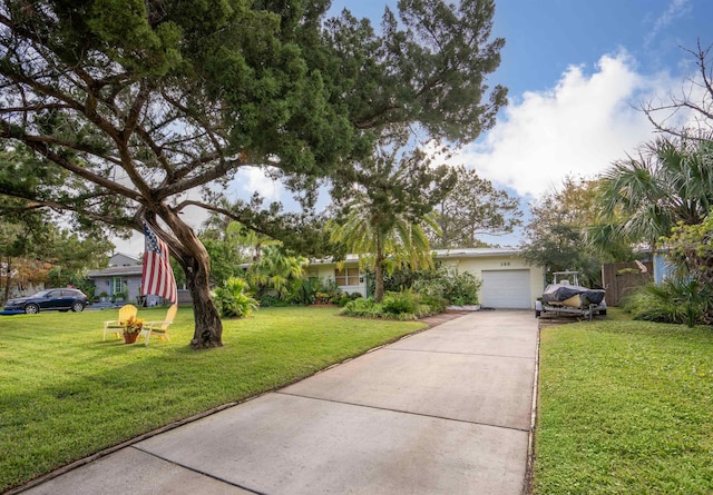 ranch-style home featuring a front yard and a garage