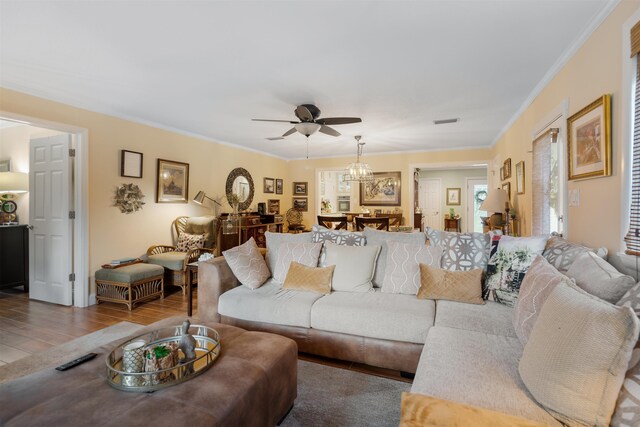 living room featuring ceiling fan, wood-type flooring, and crown molding