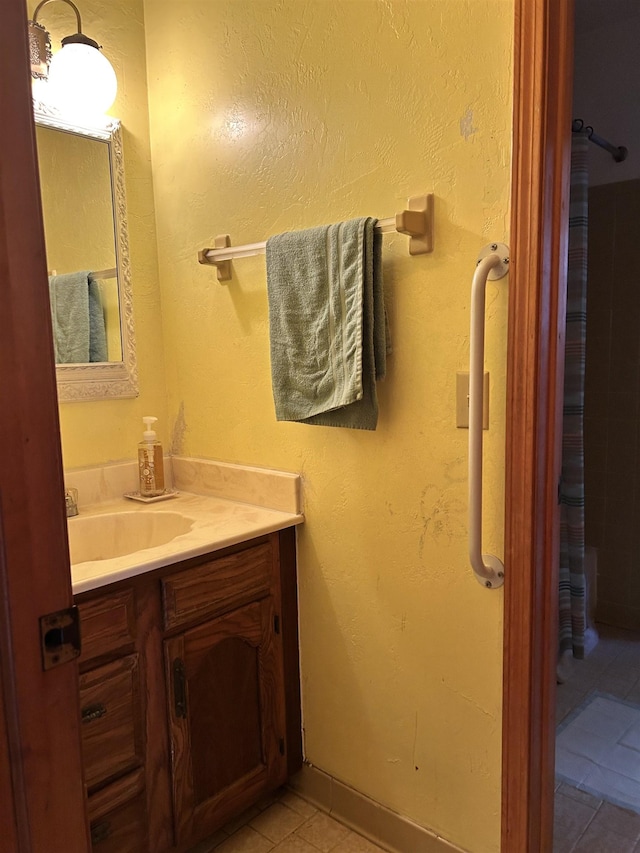 bathroom featuring tile patterned floors and vanity