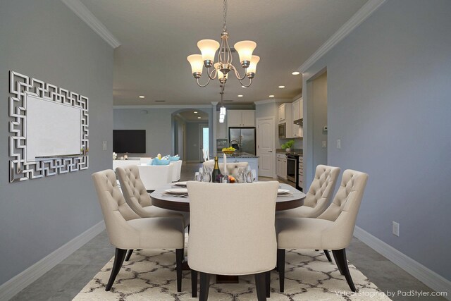 dining area with an inviting chandelier and crown molding