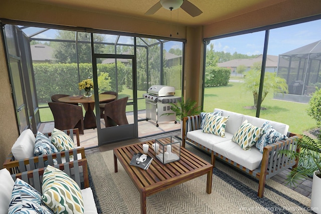 sunroom featuring ceiling fan