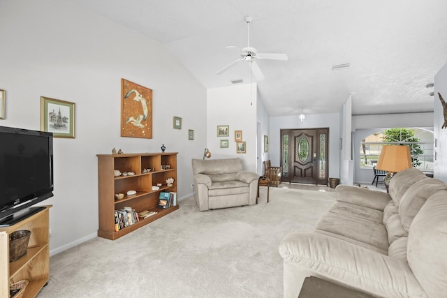 living area featuring high vaulted ceiling, light carpet, visible vents, a ceiling fan, and baseboards