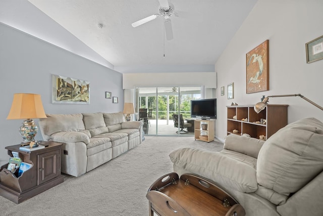 living room featuring a ceiling fan, lofted ceiling, and light carpet