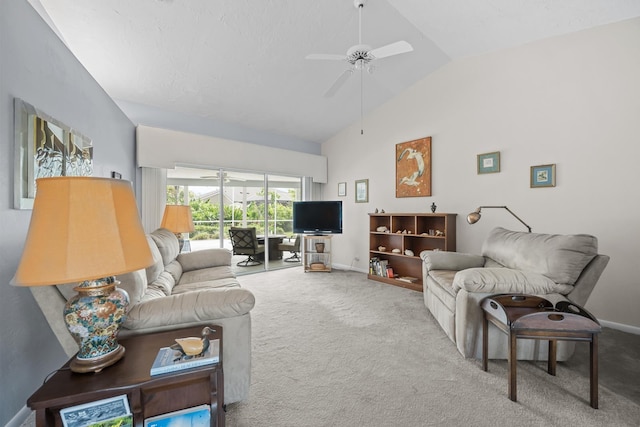 carpeted living area featuring lofted ceiling, ceiling fan, and baseboards