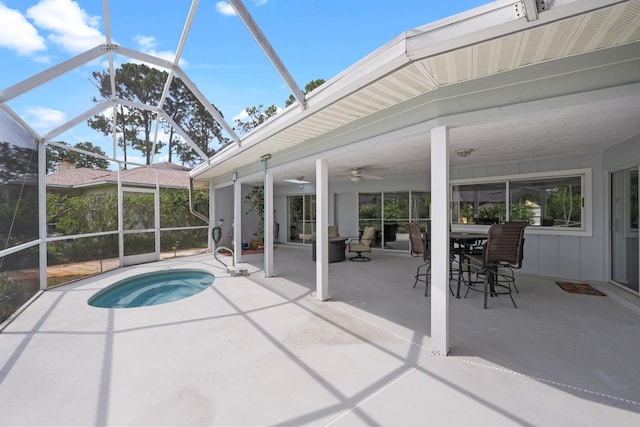 view of pool featuring a ceiling fan, glass enclosure, a patio area, and outdoor dining area