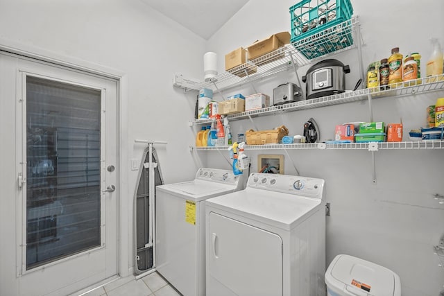 laundry room featuring laundry area, light tile patterned floors, and washer and dryer