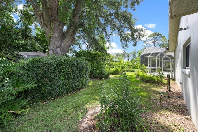 view of yard with a lanai