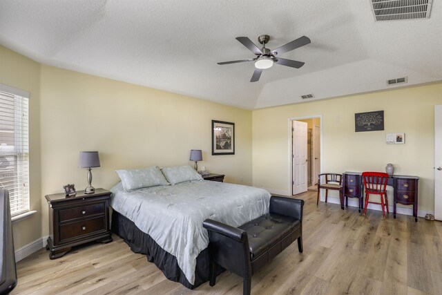 bedroom with light wood-type flooring and visible vents