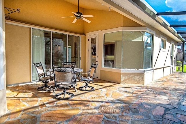 view of patio / terrace with glass enclosure and ceiling fan