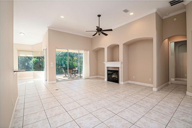 unfurnished living room featuring ceiling fan, crown molding, and light tile patterned floors