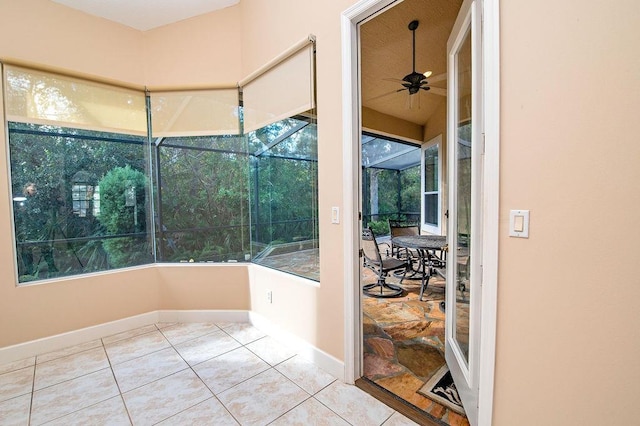 sunroom / solarium featuring ceiling fan and a healthy amount of sunlight