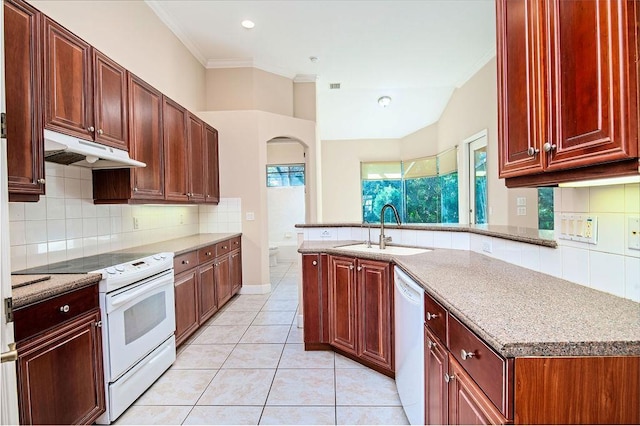 kitchen with sink, light stone counters, crown molding, white appliances, and light tile patterned floors