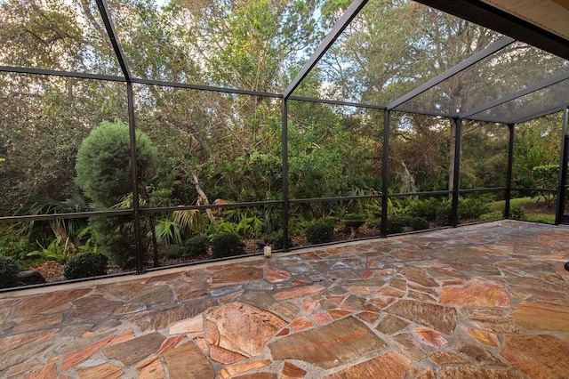 view of patio / terrace featuring a lanai