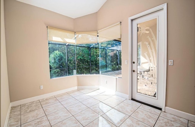 entryway featuring a wealth of natural light and light tile patterned floors