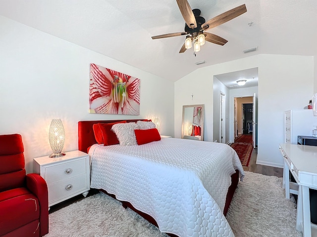 bedroom featuring lofted ceiling, ceiling fan, and wood finished floors