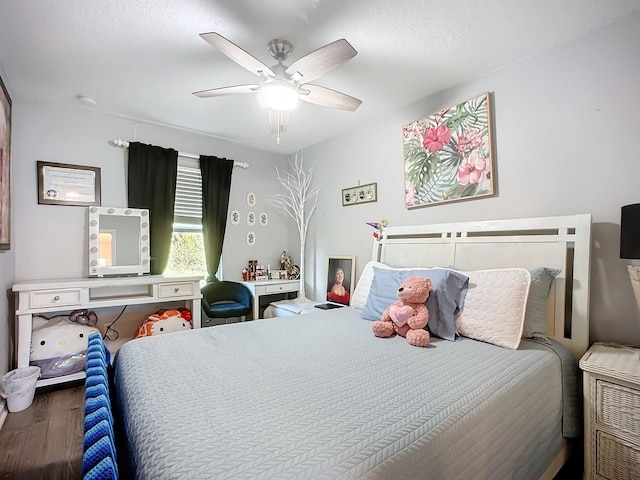 bedroom with ceiling fan and wood finished floors