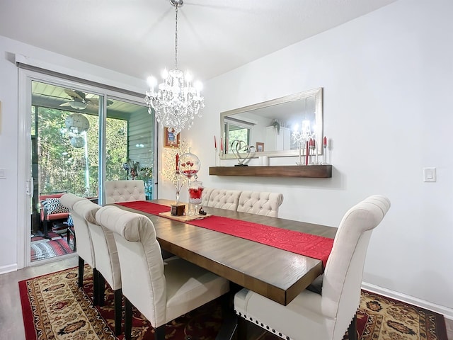 dining area featuring baseboards and wood finished floors