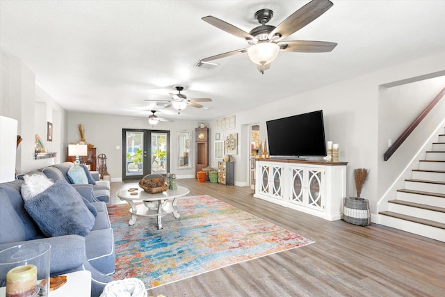 living room with wood-type flooring and french doors