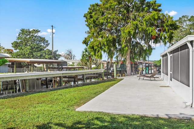 view of home's community featuring a yard and a patio