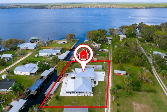 birds eye view of property with a water view