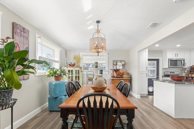 dining room featuring light hardwood / wood-style floors