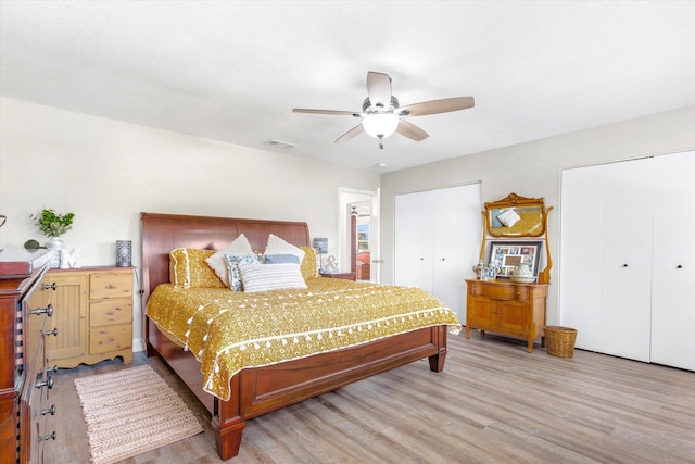 bedroom with wood-type flooring, a closet, and ceiling fan