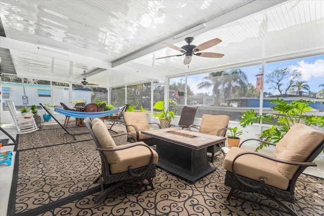 sunroom / solarium featuring ceiling fan