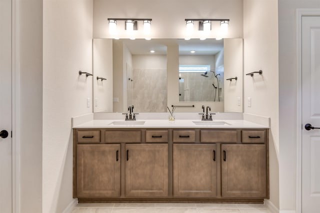 29 Turkey Trot Ct, Saint Augustine, FL 32095 - full bathroom with a tile shower, double vanity, baseboards, and a sink