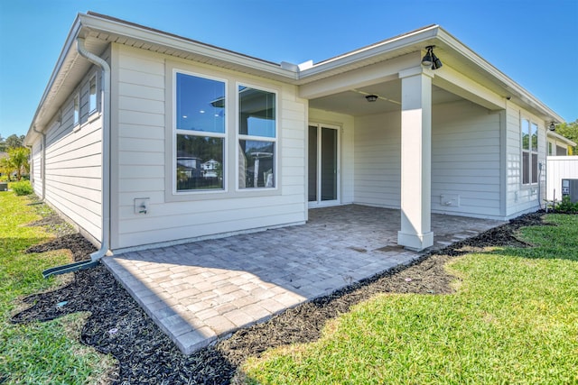 29 Turkey Trot Ct, Saint Augustine, FL 32095 - rear view of property with a lawn and a patio