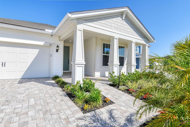 29 Turkey Trot Ct, Saint Augustine, FL 32095 - view of front of home with an attached garage, driveway, and a porch