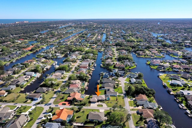 aerial view with a residential view and a water view