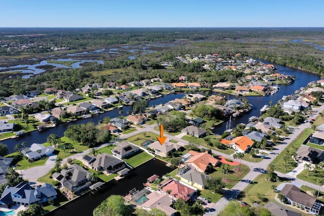 aerial view featuring a water view and a residential view