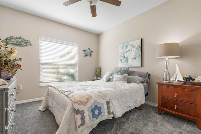 bedroom with ceiling fan, carpet, and baseboards