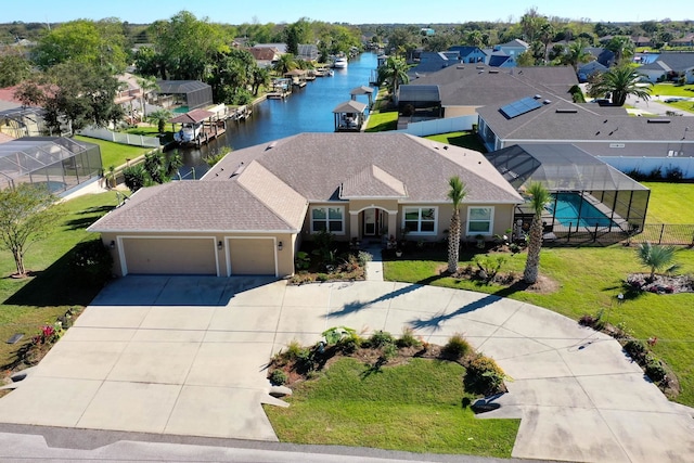 bird's eye view with a water view and a residential view