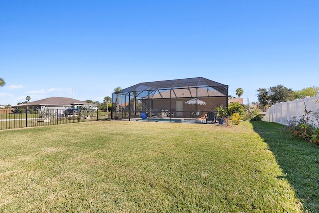 view of yard featuring a fenced in pool, a lanai, and fence