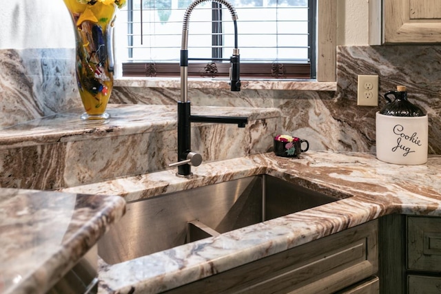 4 Santa Maria Ln, Saint Augustine, FL 32080 - kitchen view of backsplash, a sink, and light stone countertops